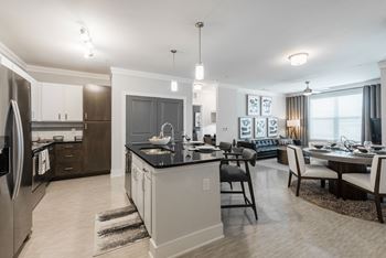 a kitchen and dining area in a 555 waverly unit